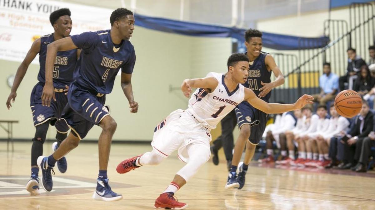 Providence Day's Devon Dotson(1) stretches to retrieve the basketball while facing Douglas County High during a Hoodie's House National High School Hoop's Classic prep basketball game Monday, December 28, 2015 held at Providence Day School. JASON E. MICZEK - Special to the Observer