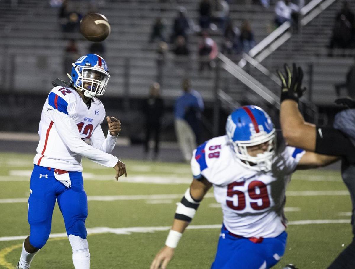North Meck quarterback Aaron Scott fires a pass against Hough on Friday.