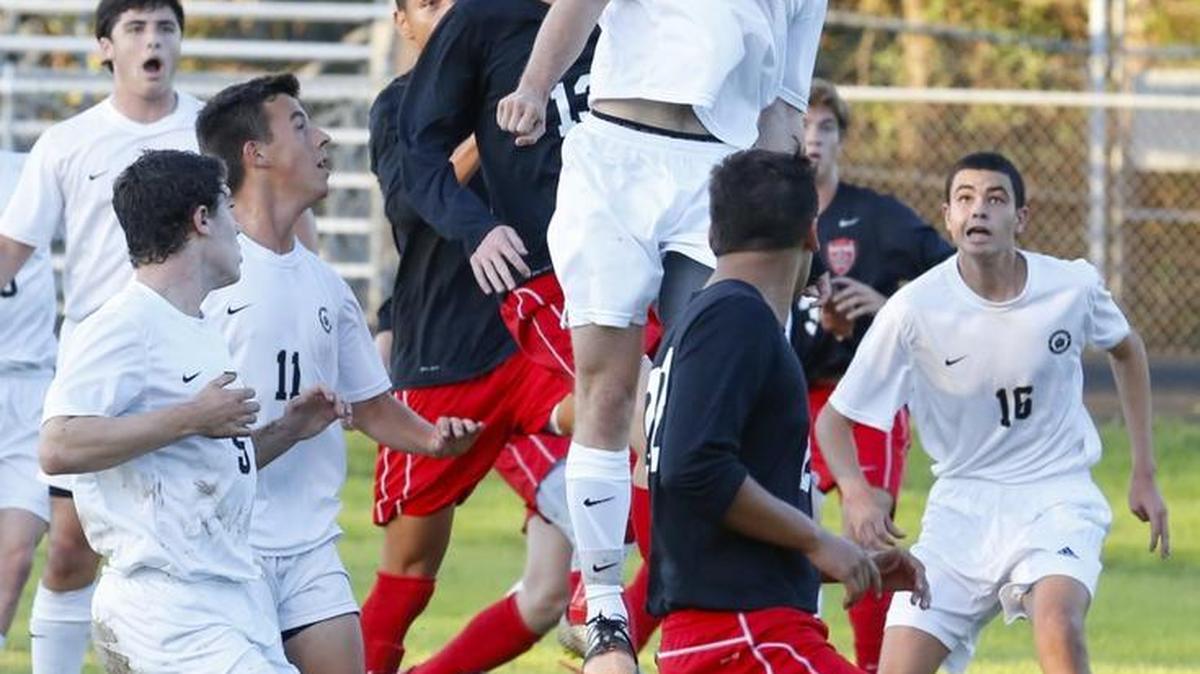 Providence's Shane Swisher, leaping to head a ball against South Meck, helped the Panthers to a 2-1 NCHSAA first round playoff win over AL Brown Tuesday. Photo by JASON E. MICZEK - Special to the Observer