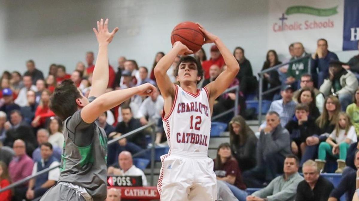 Garrett McKinstry (12) elevates and knocks down a 3-point basket. Charlotte Catholic defeated Weddington Friday, Jan. 26, 2018.