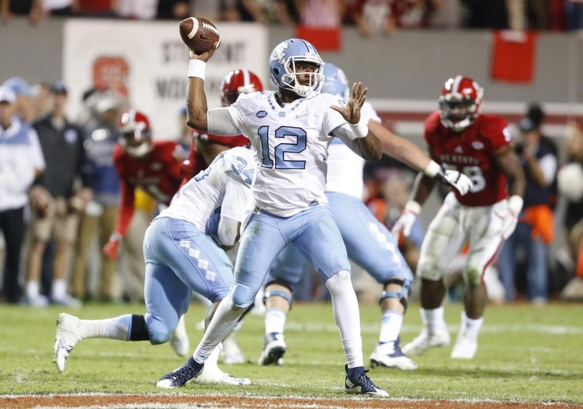 North Carolina quarterback Marquise Williams (12) passes during the second half of UNC's 45-34 victory over N.C. State at Carter-Finley Stadium in Raleigh, N.C., Saturday, Nov. 28, 2015