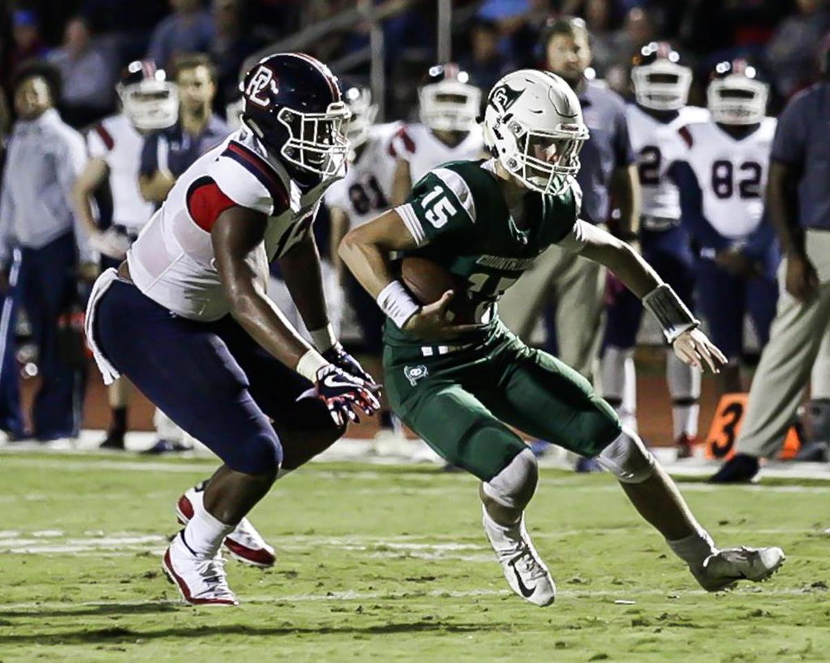 Country Day sophomore QB Russell Tabor (15) runs to the 1 in Friday’s 42-6 loss to Providence Day.