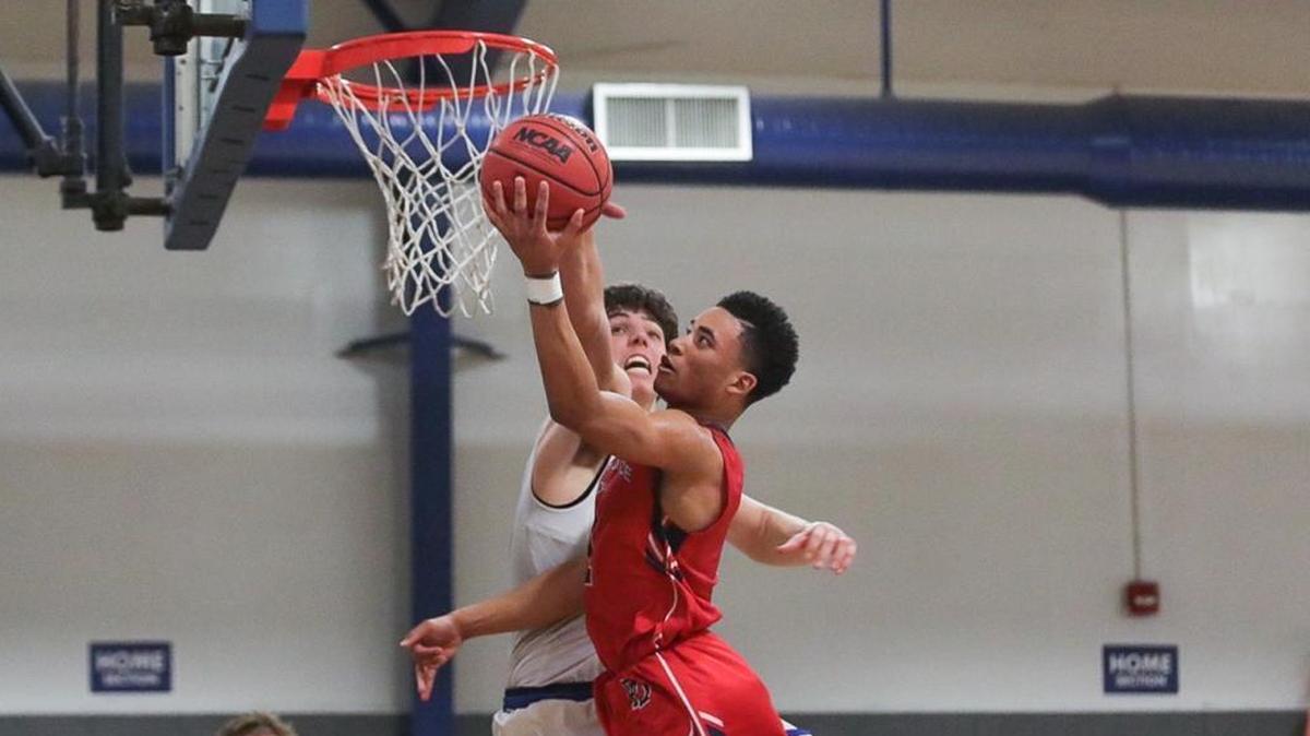 Providence Day’s Devon Dotson, playing in front of Kansas coach Bill Self, led the Chargers past Blake Preston and the Knights in a big 81-65 CISAA win Tuesday.