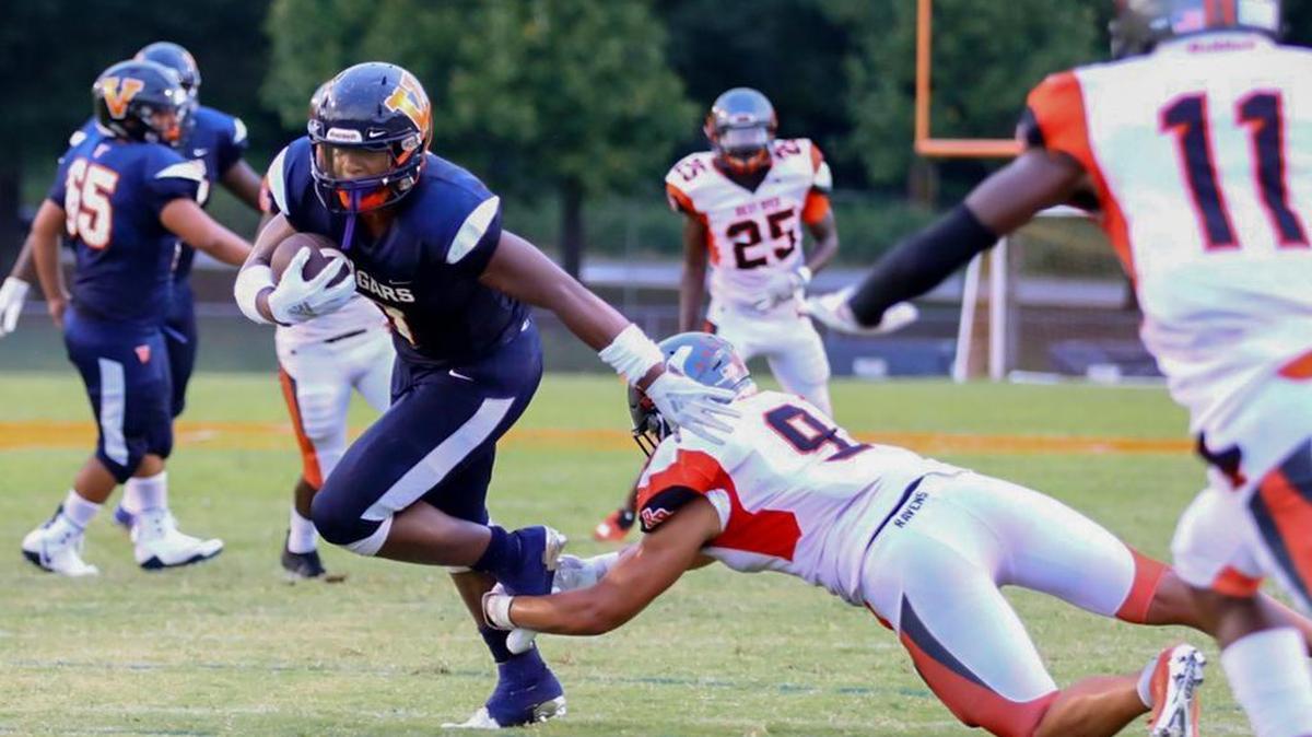 Rocky River’s Jaylon Sharpe (9) makes an open-field tackle on Nigel Summerville (left) during the first quarter of Friday’s game at Vance.