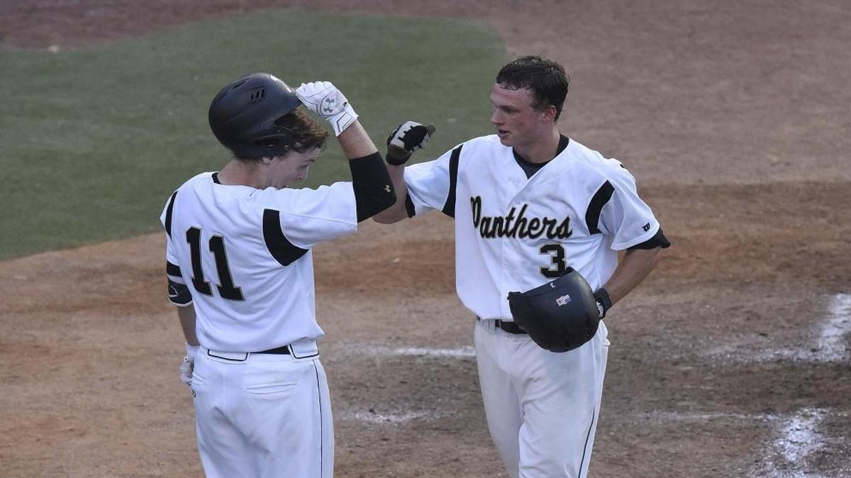 Providence high's Zach Brown on right elbow bumps Jake Holtzapple on left, after Brown hits a home run during Wednesday night's first round playoff game played at Providence high school May 11, 2016.