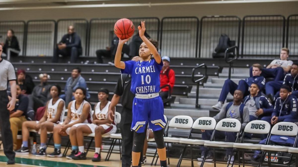 Carmel Christian's Ashlynn Dotson (10) shoots a three point shot from the wing during early first half action. BSN Queen City Clash Women's Final December 23, 2017.