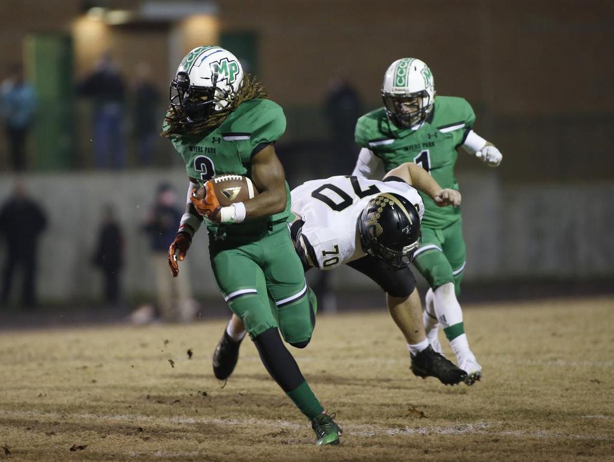 Myers Park safety Cameron Roseman-Sinclair runs after intercepting a Providence pass in the first quarter on Friday in the first round of the N.C. 4AA high school football playoffs.