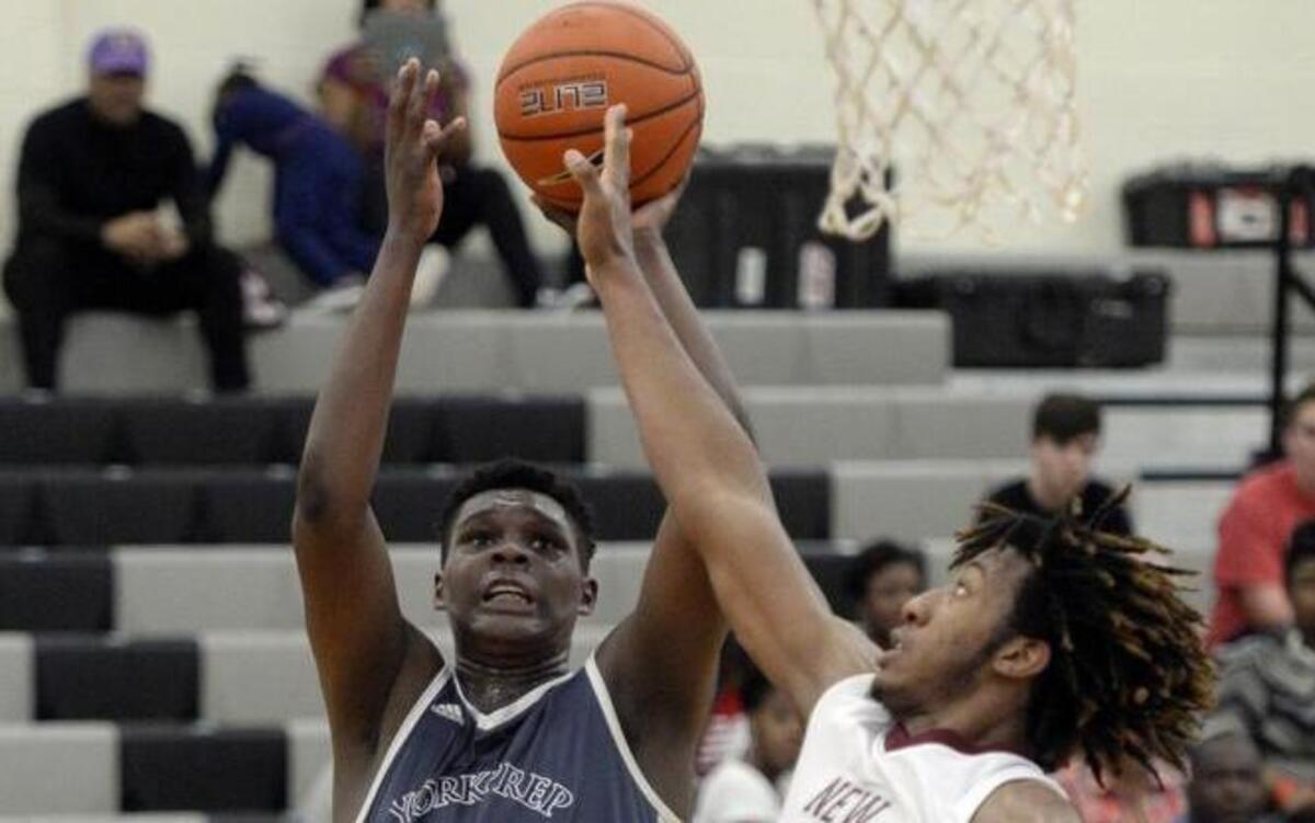 York Prep's DJ Burns (32) shoots over New Hampstead's Xavier Jones (23) during their game in the Charlotte Hoops Challenge at Rocky River High School on Friday, November 25, 2016.
