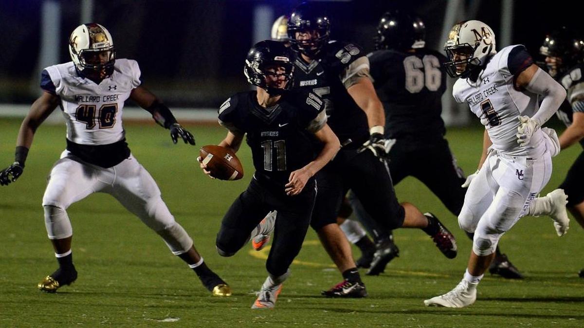 Hough quarterback Jackson Gibbs, center, led his team to a regular-season upset of Mallard Creek last season, a loss the Mavericks avenged in this 2015 playoff game. Mallard Creek and Hough meet again Friday night