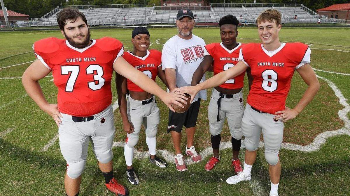 
South Mecklenburg’s key starters (from left): Will Jones, Chance Kennedy, coach Rocky White, Moryah Johnson and A.J. Elam. The Sabres are 4-0 and off to their best start since 1989.

