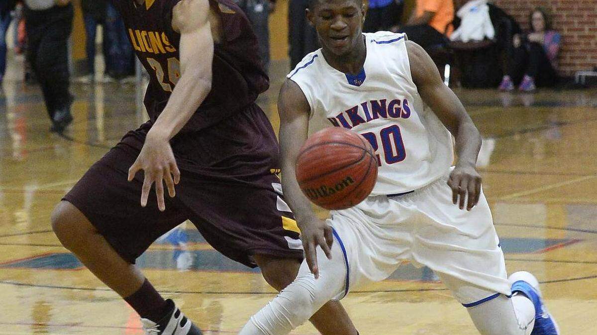 North Meck's Kendal Coles, right, steals the ball from West Charlotte's Isayah Johnson Wednesday night.