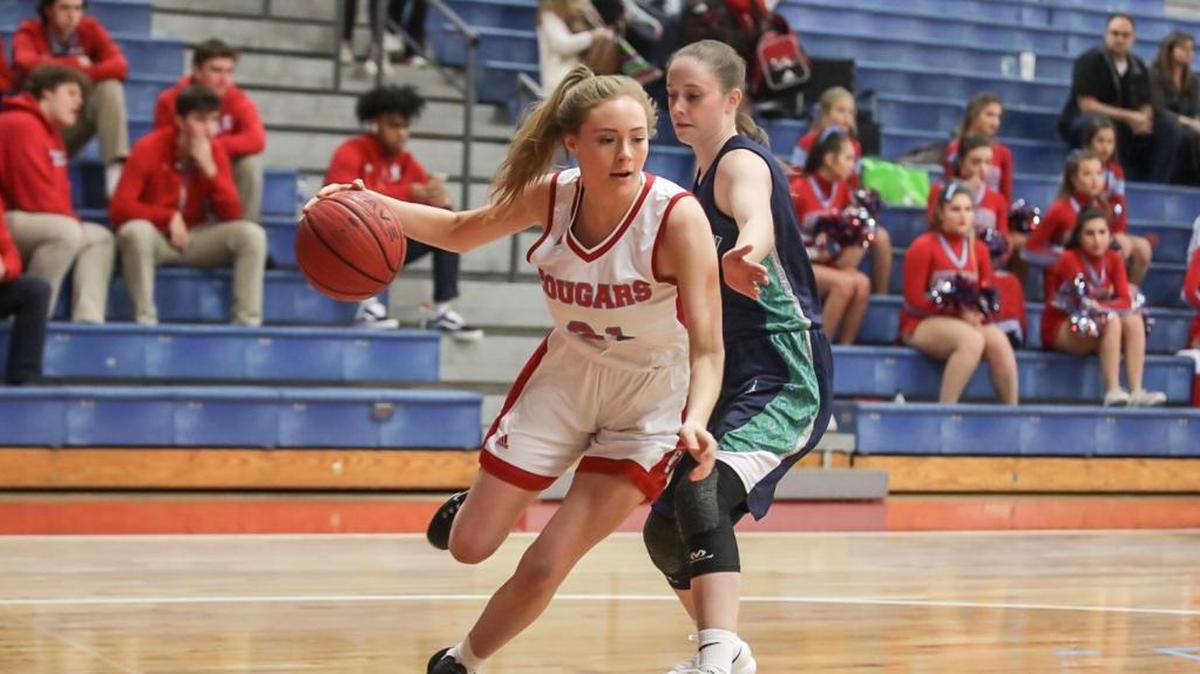 Charlotte Catholic's Maggie Dupre drives the baseline early in the first quarter. Charlotte Catholic defeated Weddington Friday, Jan. 26, 2018.