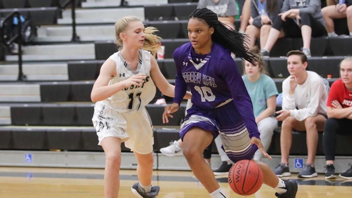 Ardrey Kell’s Deniyah Lutz tries to dribble past Hough’s Caroline Swartz in the teams’ game Wednesday at Hough High.
