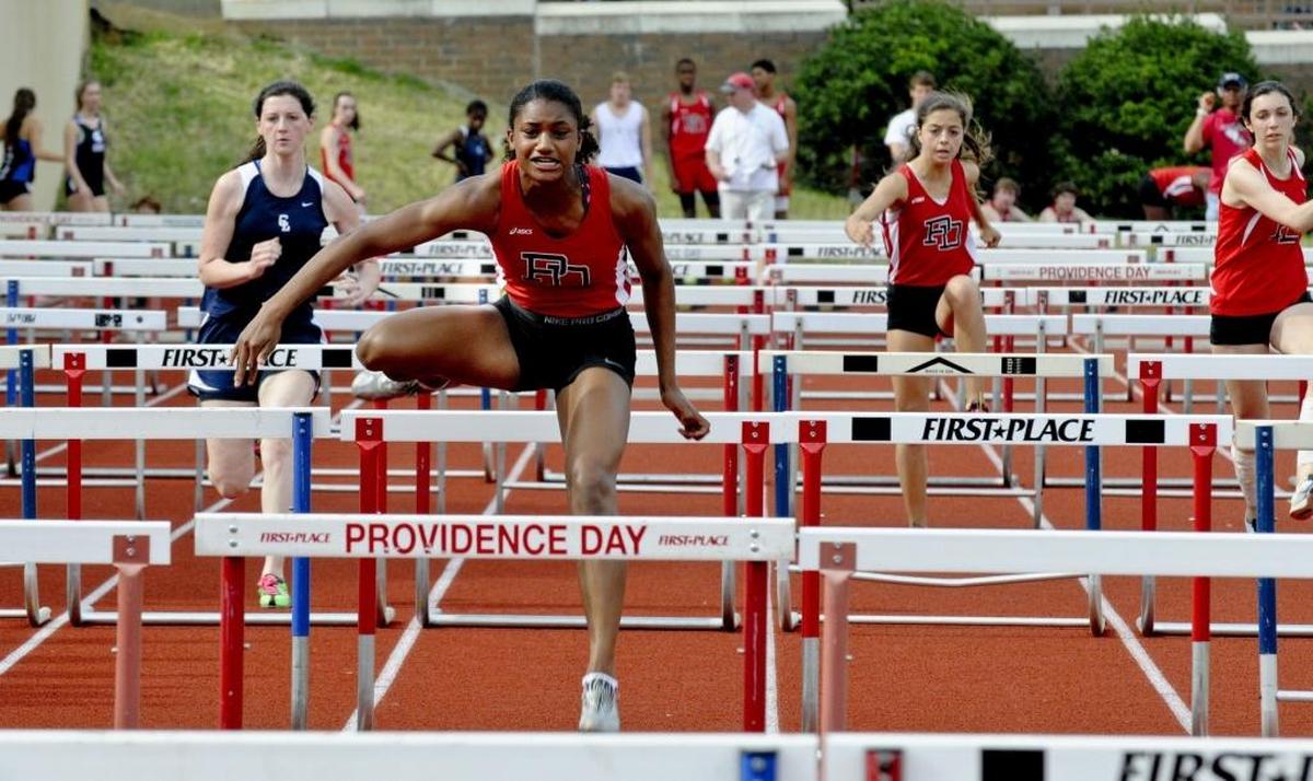Anna Cockrell starred in track for Providence Day and is now headed to the Tokyo Olympics in the Anna Cockrell clears a hurdle in a recent meet