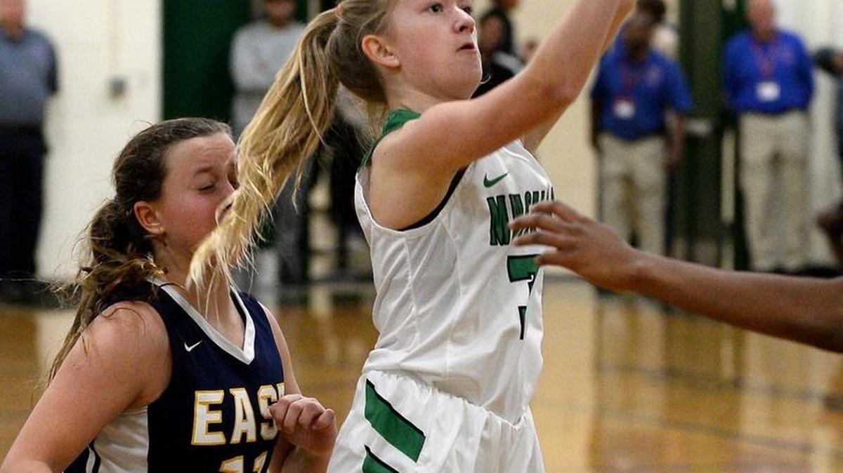 Myers Park's Chaselyn Dunn, center, releases a shot in the lane during second half action against East Meck in the Southwestern 4A tournament at Myers Park High School on Tuesday, February 14, 2017.