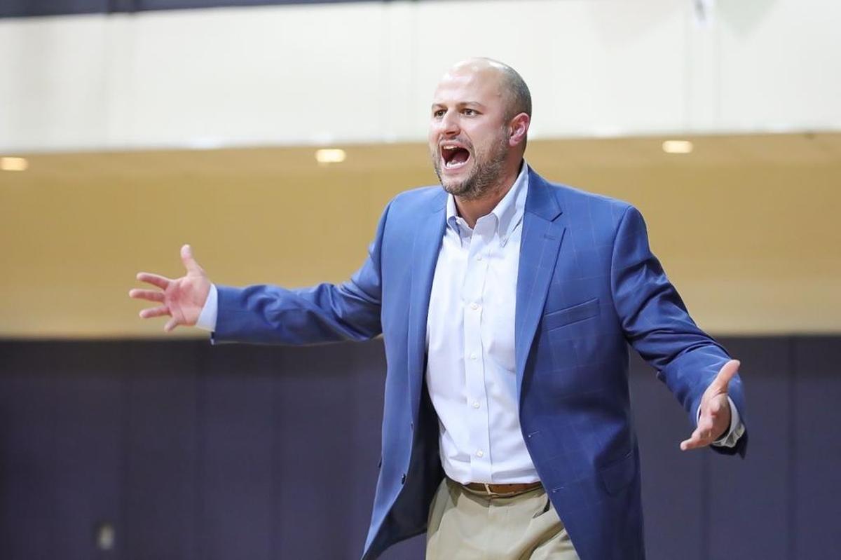 Gaston Day's head coach Trent McCallister motivates his team to play stronger defense during late 2nd half action.