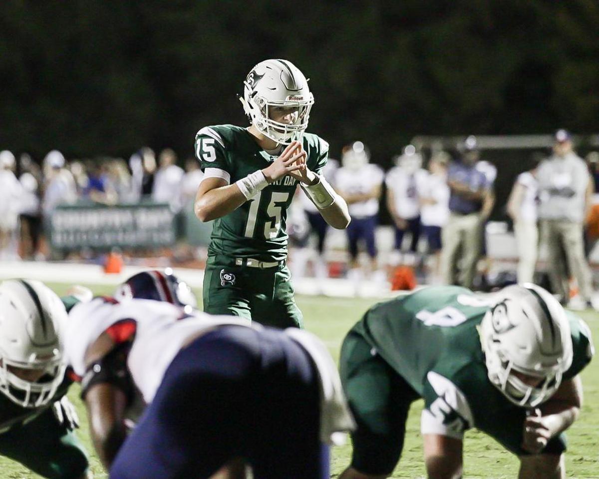 Charlotte Country Day sophomore QB Russell Tabor (15) led the Buccaneers in a CISAA conference game with rival Providence Day Friday