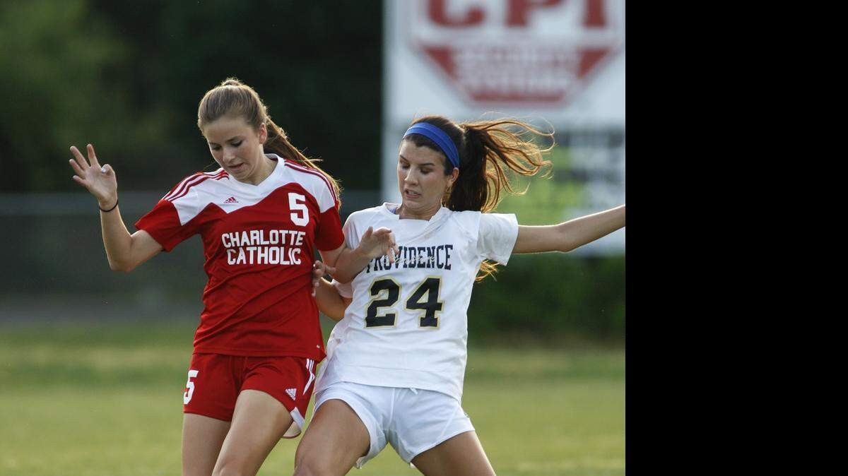 
Providence midfielder Ellie Deaver, right, battles Charlotte Catholic forward Lindsey Poff in girls third round 4A soccer match Wednesday, May 20. 2015 at Providence High School. (Special to the Observer by Nell Redmond)
