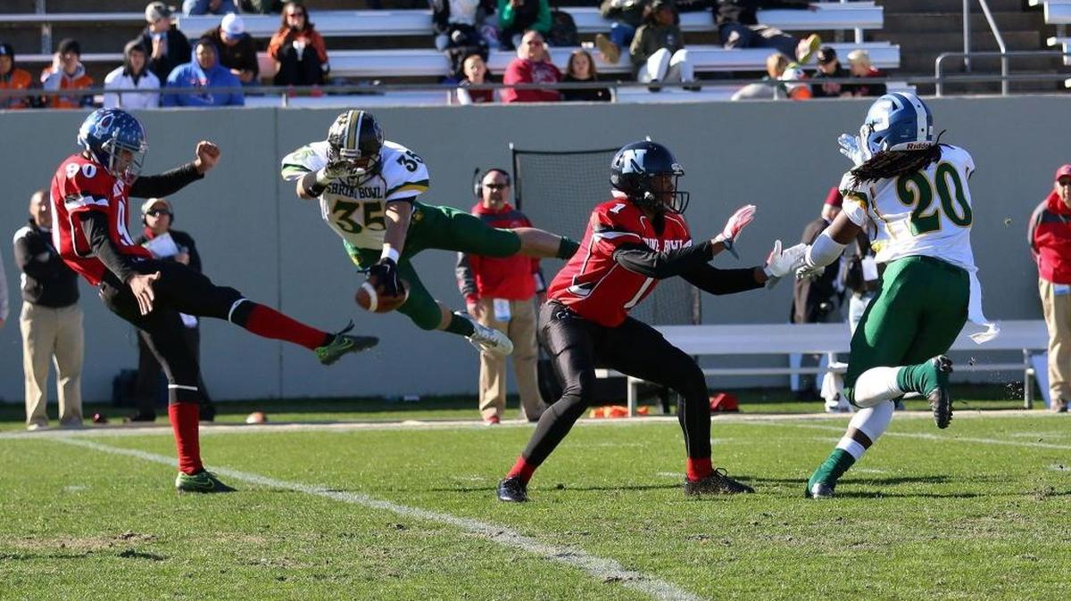 Providence High’s Tyler Pistorio of Providence blocks a punt in Saturday’s Shrine Bowl in Spartanburg. A team of N.C. high school seniors beat their S.C. counterparts 54-39