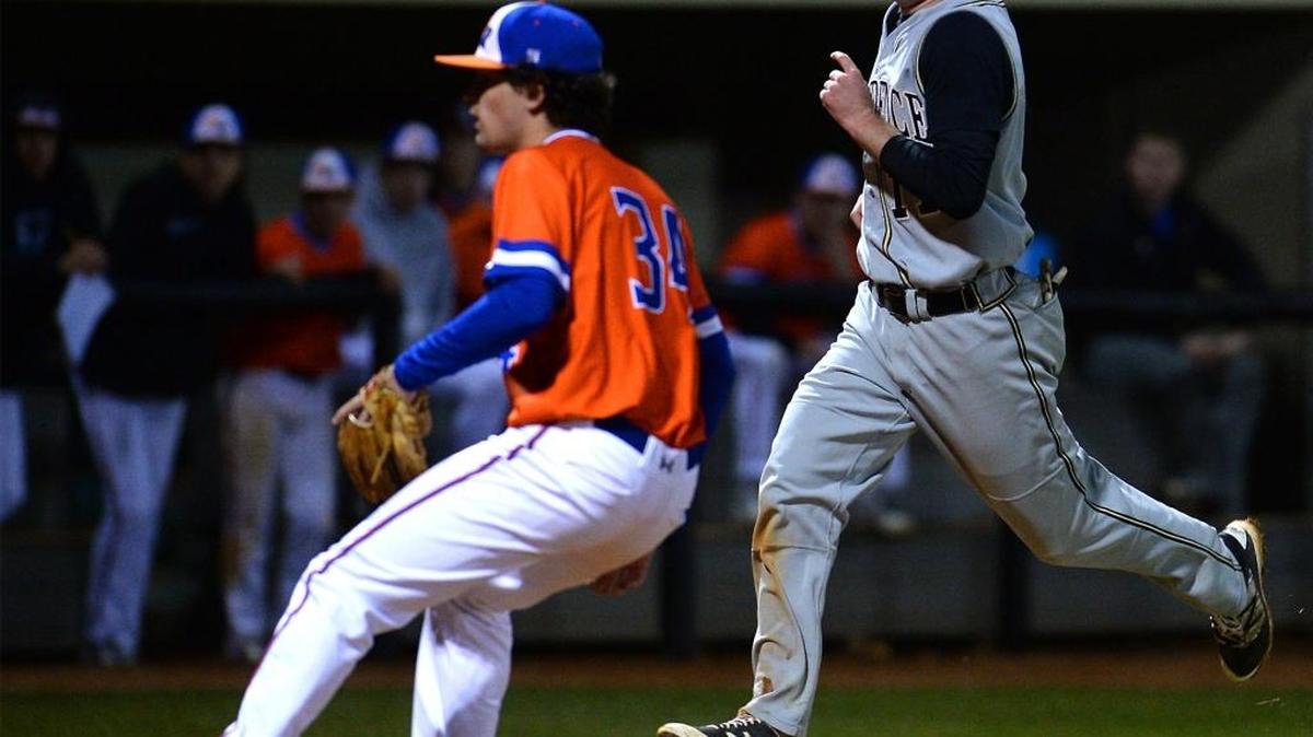 Providence High Tucker Jones, right, scores a run as Marvin Ridge pitcher Zach Zdimal looks to cover the plate following a wild pitch during prep baseball action on Friday, March 4, 2016 at Marvin Ridge High School. Providence defeated Marvin Ridge 2-0.