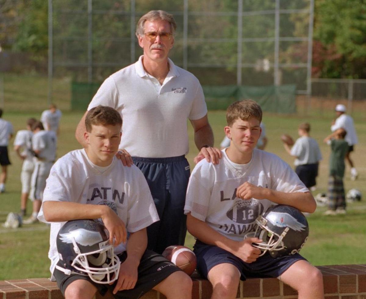 In 1994, Charlotte Latin coach Larry McNulty coached his sons: Connor (left), a senior linebacker, and Carson, a sophomore quarterback.