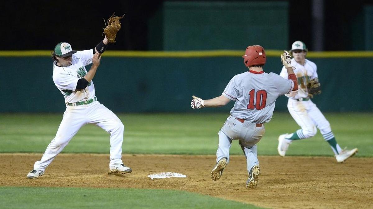 Providence Day runner Max Lahn (10) makes it safely to second base before Myers Park second baseman Carson Schuster on left, makes the tag during Wednesday’s game in the Jack Sink Spring Break Invitational baseball tournament.