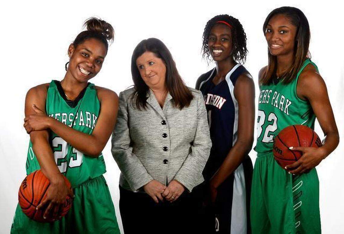 All-Observer basketball team members and coach, from left, Aliyah Mazyck of Myers Park, head coach Barbara Nelson of Myers Park, Maya Caldwell of Davidson Day School and DD Rogers of Myers Park.