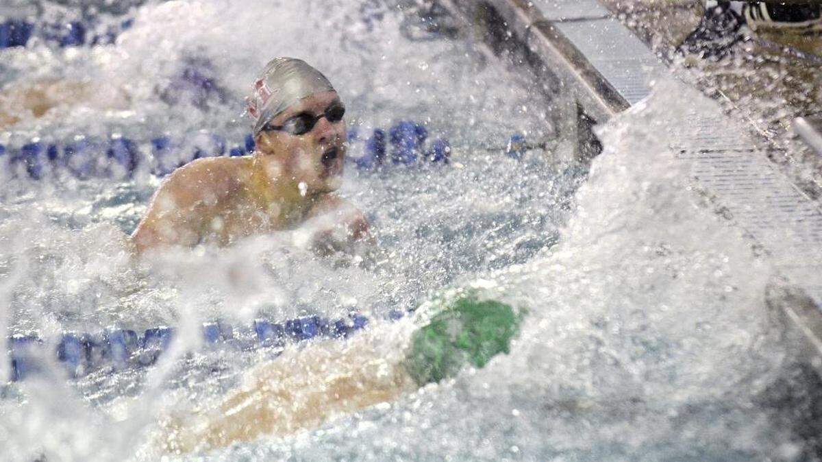 Graham Weaver, a senior at South Mecklenburg High School, watches his competitors touch the wall as they finish the men's 50 yard freestyle event Saturday. Weaver won heat three. The NC 4A West regional swimming & NC 3A West regional diving championships were held at Huntersville Family fitness & Aquatic Center on Saturday, Feb.6, 2016.
