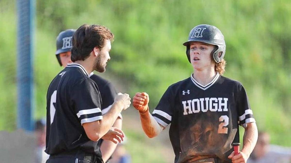 Hough Huskies short stop Jon Schuldt (2) scores off of a base hit single. Hough would face the number 1 seed Lake Norman Wildcats in the 4A I-Meck Tournament Championship.