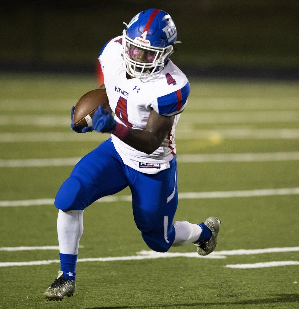 North Meck running back Fabian Duncan carries the ball for the Vikings in Friday’s high school football game at Hough.