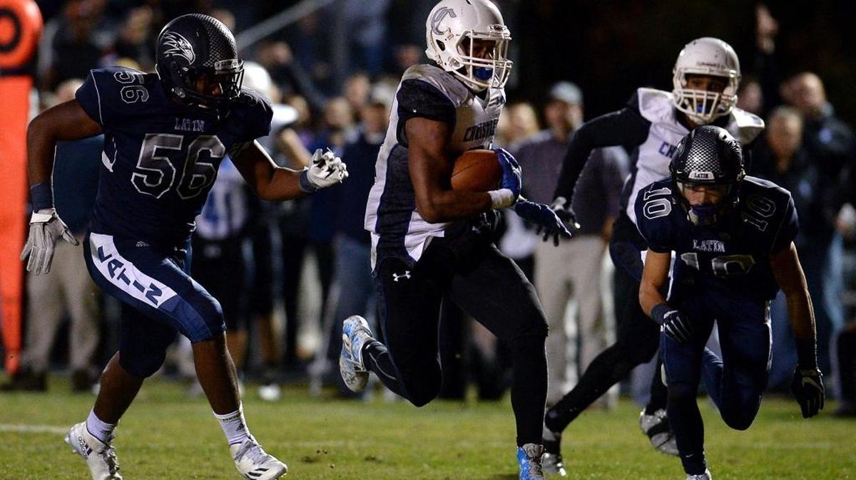 Charlotte Christian running back Justus Woods, center, will try to lead his team back to the N.C. Independent Schools Division I championship this season.