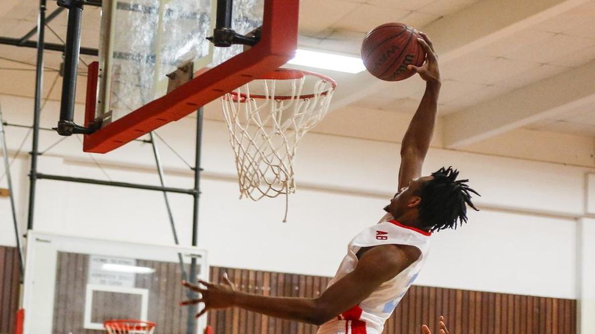 Olympic's Jalen Harris dunks against Rocky River in high school basketball action in Charlotte, N.C., Tuesday, Feb. 21, 2017. (Nell Redmond photo)