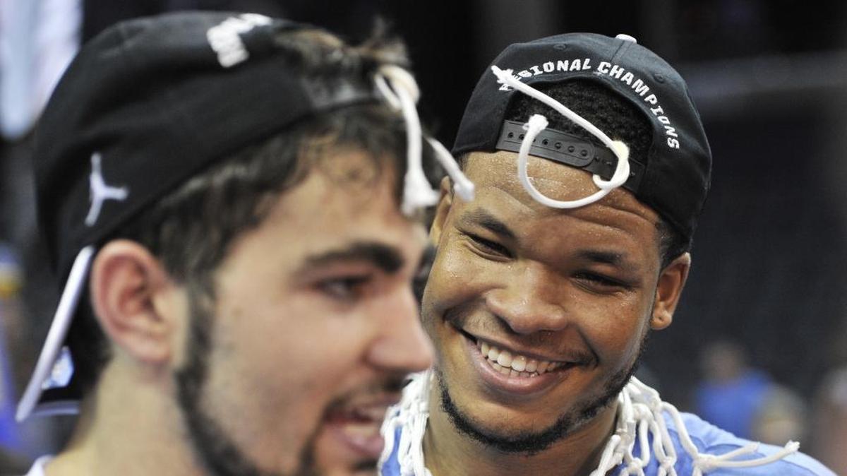North Carolina's Kennedy Meeks, right, and Luke Maye helped lead UNC to a national title in April. The two players’ high school alma maters entered the Observer’s Sweet 16 poll this week