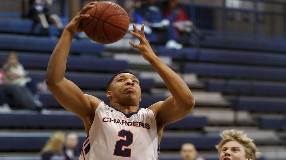 Providence Day forward Grant Williams, left, drives to the basket past Covenant Day forward JP Corser in the first half of a prep basketball game Monday, Jan. 25, 2016.