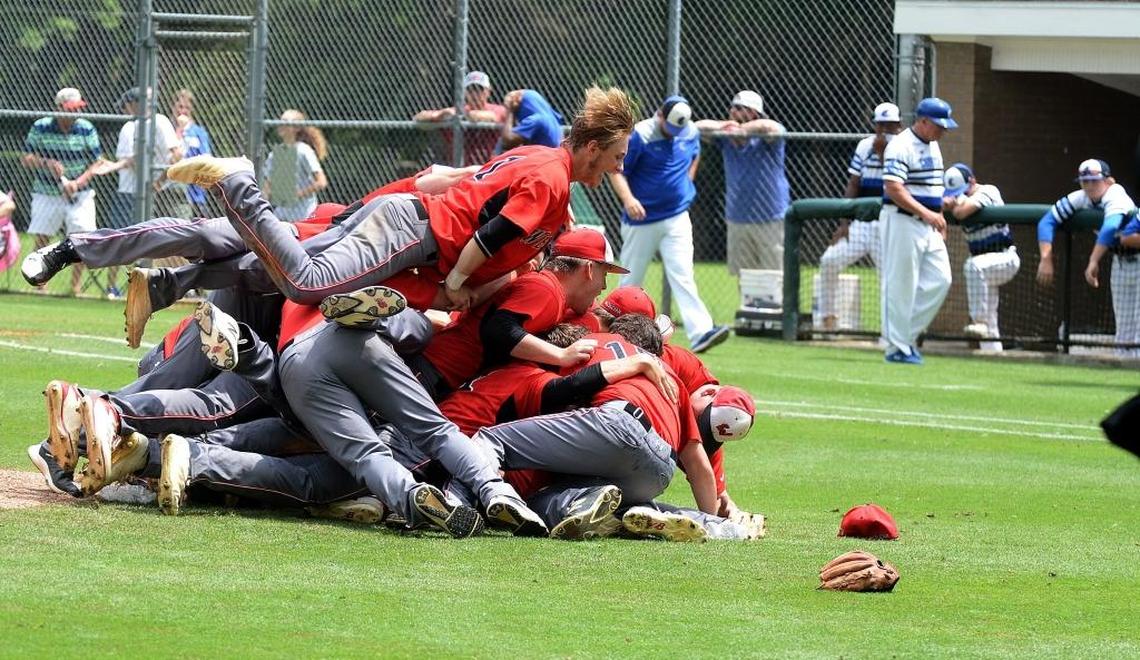 Wesleyan Christian Academy baseball players celebrate winning over Charlotte Christian in the NCISAA 3A state championship baseball game at Charlotte Country Day Saturday afternoon.