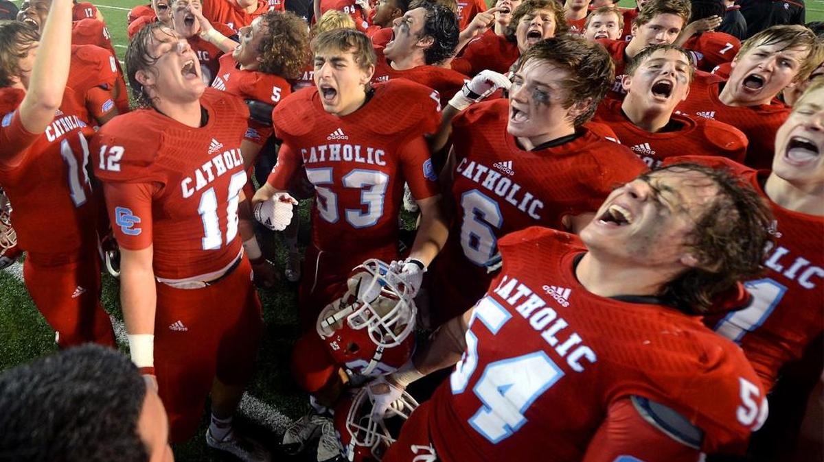Charlotte Catholic’s football players, seen here celebrating a state championship in December, moved up two spots in the N.C. Associated Press 4A poll this week