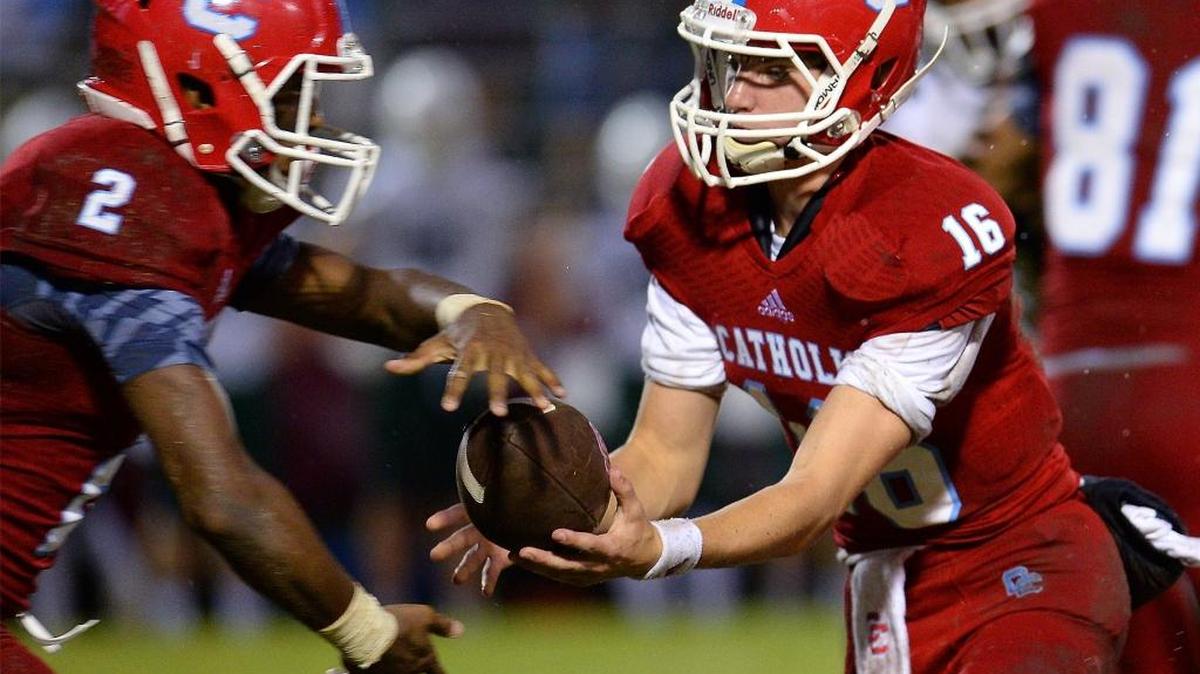Charlotte Catholic quarterback Brady Berger, right, has helped the Cougars get into the running for another SoMeck 8 league title. But the race is tight.