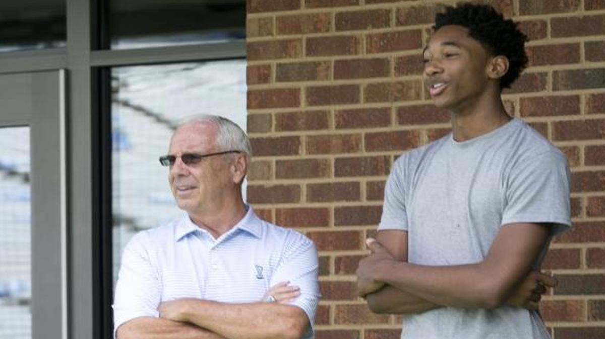 North Carolina men’s basketball coach Roy Williams (left) chats with recruit Rechon “Leaky” Black before a Tar Heels football game at Kenan Stadium in September. Black committed to North Carolina in January 2016.
