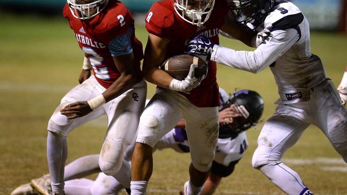 Charlotte Catholic running back Jack Brigham (center) leads the Cougars with 1,464 rushing yards. Friday, Catholic will play host to Greensboro Dudley in the N.C. 4A football semifinals.