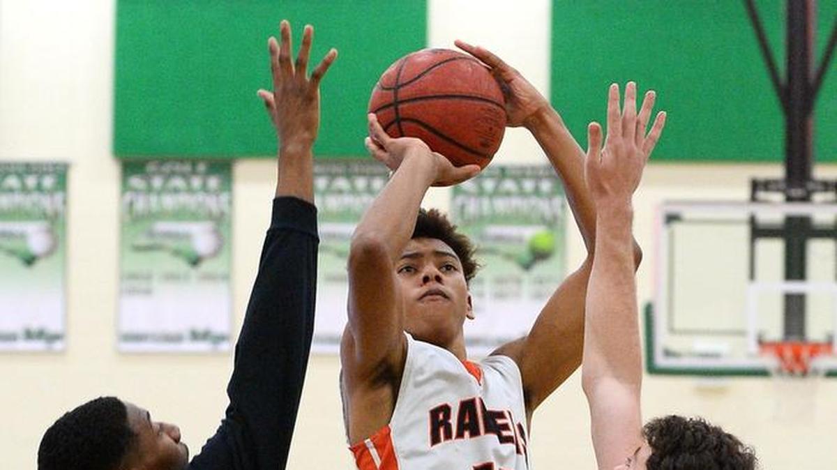 Rocky River's Jaden Springer, center, helped his team to a win at Vance Thursday