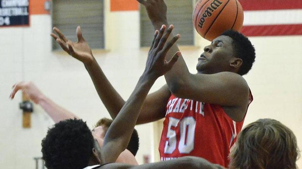 Charlotte Catholic 6-7 freshman B.J. Mack loses the ball in Saturday’s game with West Charlotte