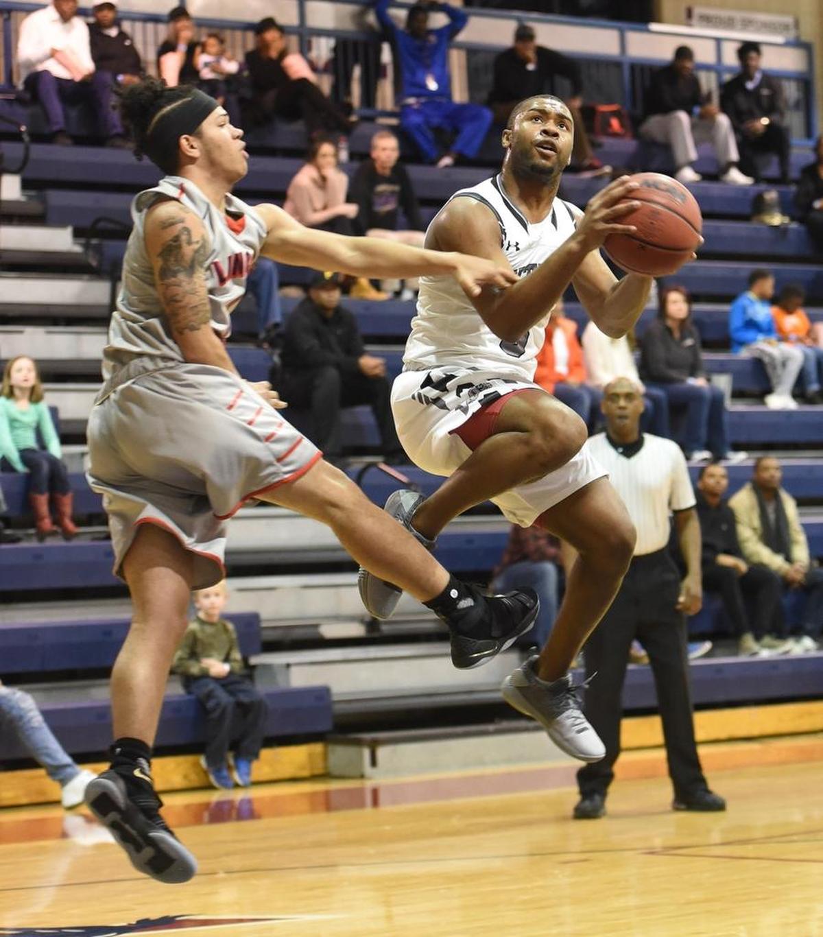 Butler’s D.J. Little (3) goes to the basket in Friday night’s Hoodie’s House national tournament game at Providence Day.
