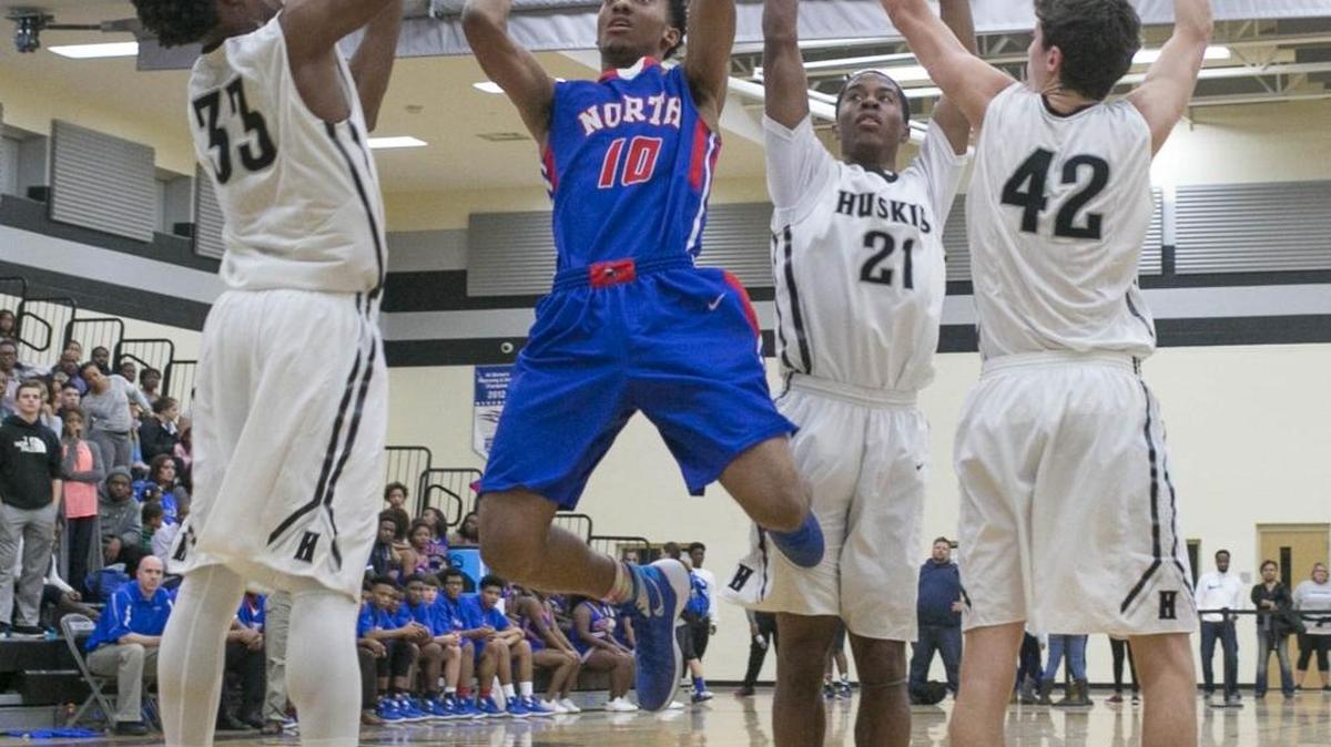 North Meck's Davion Mintz (10) drives to the basket while facing Hough during a MECKA conference prep basketball game Friday, January 8, 2016 at Hough High School. North Meck won 68 - 63. Photo by JASON E. MICZEK - Special to the Observer