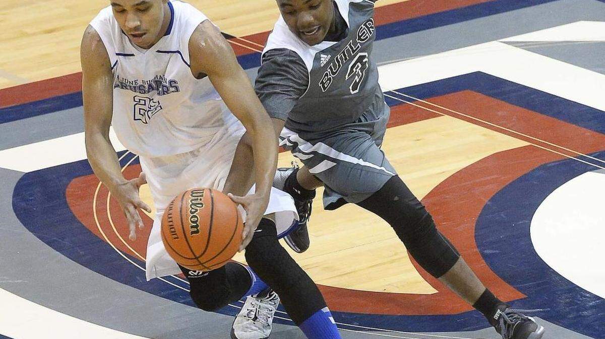 Butler's Raequan Scott on right, attempts to steal the ball from June Buchanan's Elijah Branham on left, during the second round of Hoodies House of Hope tournament at Providence Day on Dec. 30, 2015.