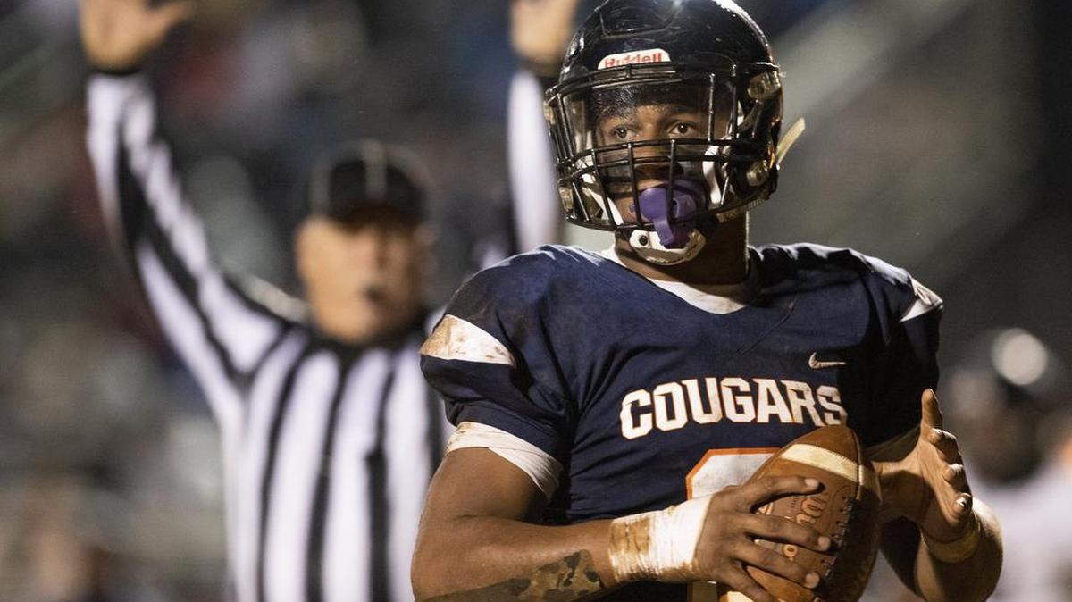 Hough running back Andre Jerone White Jr. scores a touchdown against Hough in the second quarter on Friday night.