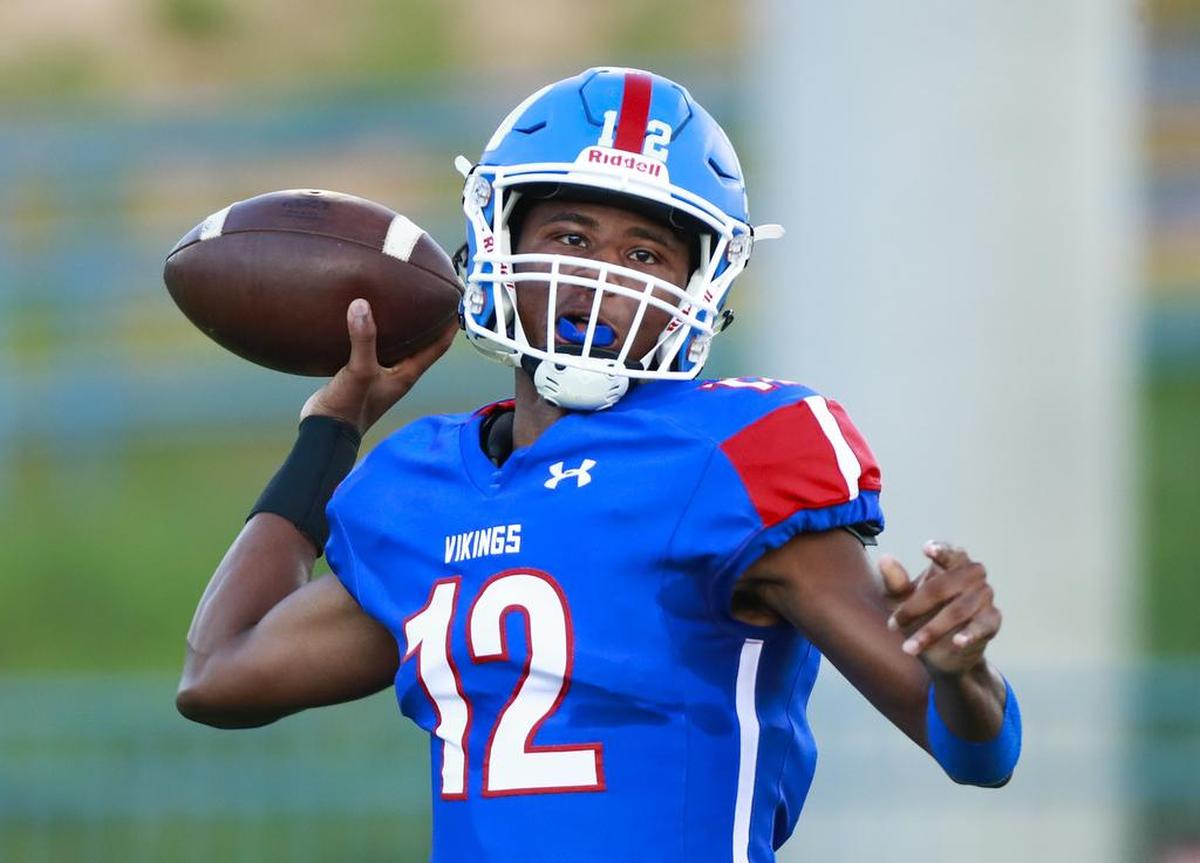 North Meck quarterback Aaron Scott passed for three touchdowns and rushed for another in the Vikings’ 43-24 win against Cox Mill.
