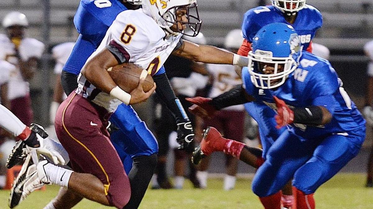 West Charlotte WR #8 Dezmien Berry runs against North Meck during the 2015 season. West Charlotte will play on a new turf field next season thanks in part to a $200,000 grant from the Carolina Panthers