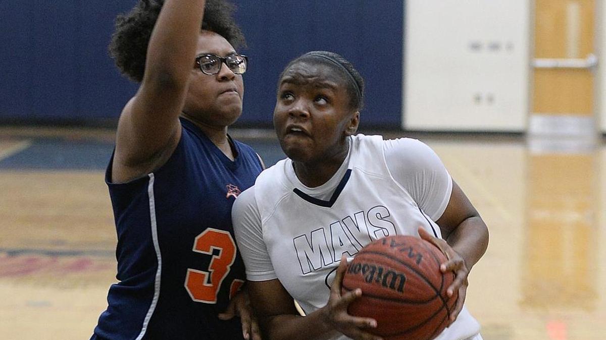 Mallard Creek’s Chantel Williams, right, drives down court to the basket over Vance’s Kayla Hurt.