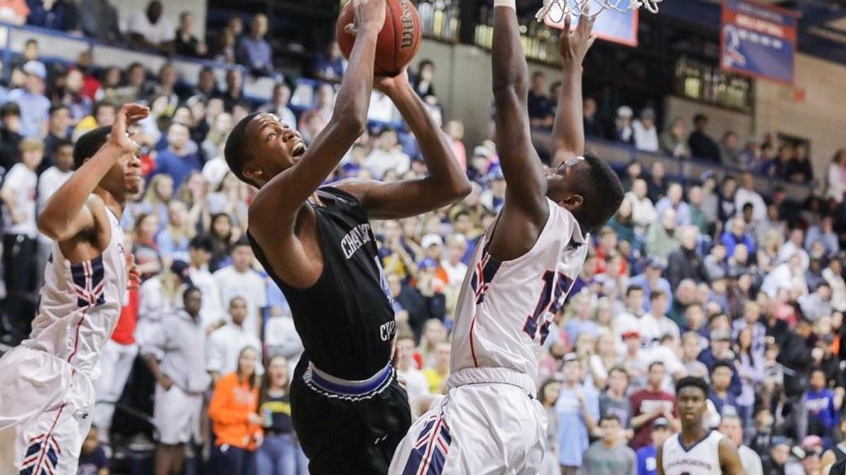 Charlotte Christian's Paul Hudson drives the lane and finishes the layup. Providence Day advanced to the NCISAA 3A semifinals by defeating Charlotte Christian on Friday.