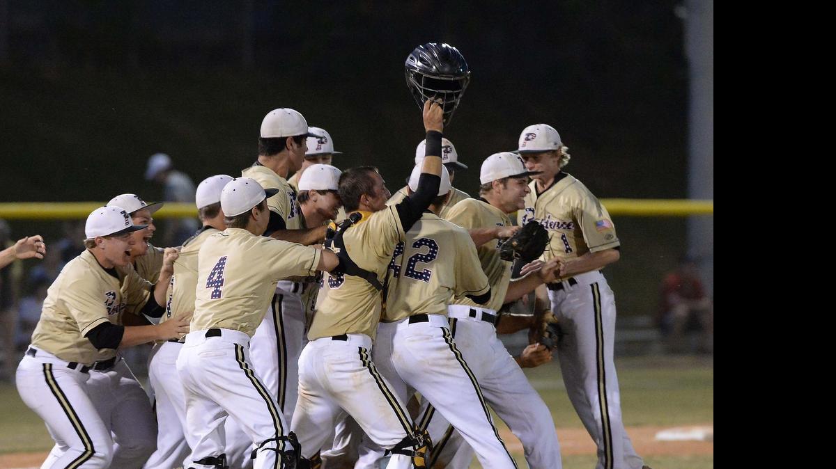 
Providence players rush the mound to celebrate their 5-0 win at Butler on Thursday. The Panthers advanced to next week’s N.C. 4A finals.


